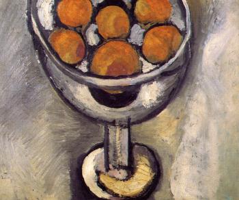 a vase with oranges